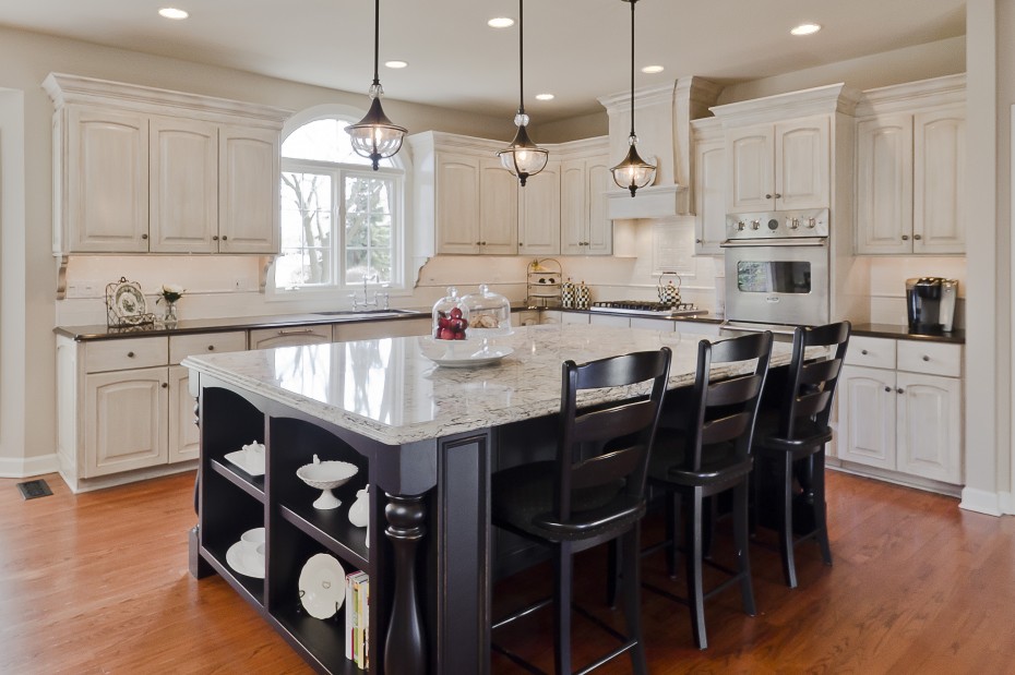 Sweet Three Brushed Olde Bronze Rustic Style Kitchen Island Lighting Over White Gloss Granite Top Black Wooden Island Escorted By Storage Also 3 Black Wooden Barstool On Wooden Floors Kitchen Designs