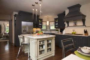 Kitchen Designs Well Liked Tear Glass Brushed Nickel Chrome Kitchen Island Lighting Over White Wooden Island Escorted By Clear Glass Door Storage As Well As Single Stainless Stool Leg On Wood Floors In Mod The Characteristics of Modern Contemporary Kitchen