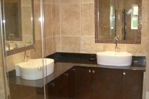 Bathroom Designs Outstanding Image Of Small Bathroom Remodels Decoration Using L Shape Cherry Wood Bathroom Vanity Including Cream Porcelain Tile Bathroom Wall Also Oval White Ceramic Bathroom Vessel Sinks To Renovate Small Bath Design
