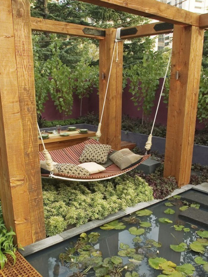 Furniture + Accessories Amazing Wooden Outdoor Canopy Bed Best Romantic Style Escorted By Four Wooden Poles Also Hang A Comfortable Bed Along Escorted By Some Pillows Escorted By Plants Surrounding Also Include Pond Elegant Outdoor Canopy Beds