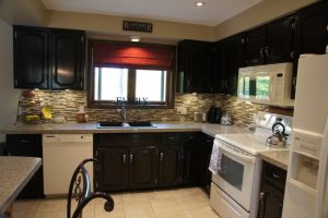 Kitchen Designs Thumbnail size Awesome Ceiling Kitchen Lighting Over Teak Wooden Finished Espresso Kitchen Cabinets Escorted By Gray Tiled Backsplash Also Marble Gray Countertop In Contemporary Kitchen Style Scheme Splendid