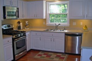 Kitchen Designs Thumbnail size Charming Yellow Wall Painted Also White Wood Cabinet Set In Small Kitchen Plan Also Laminate Wood Floors Schemes Prodigious Small Kitchen In Efficient As Well As Creative Schemes