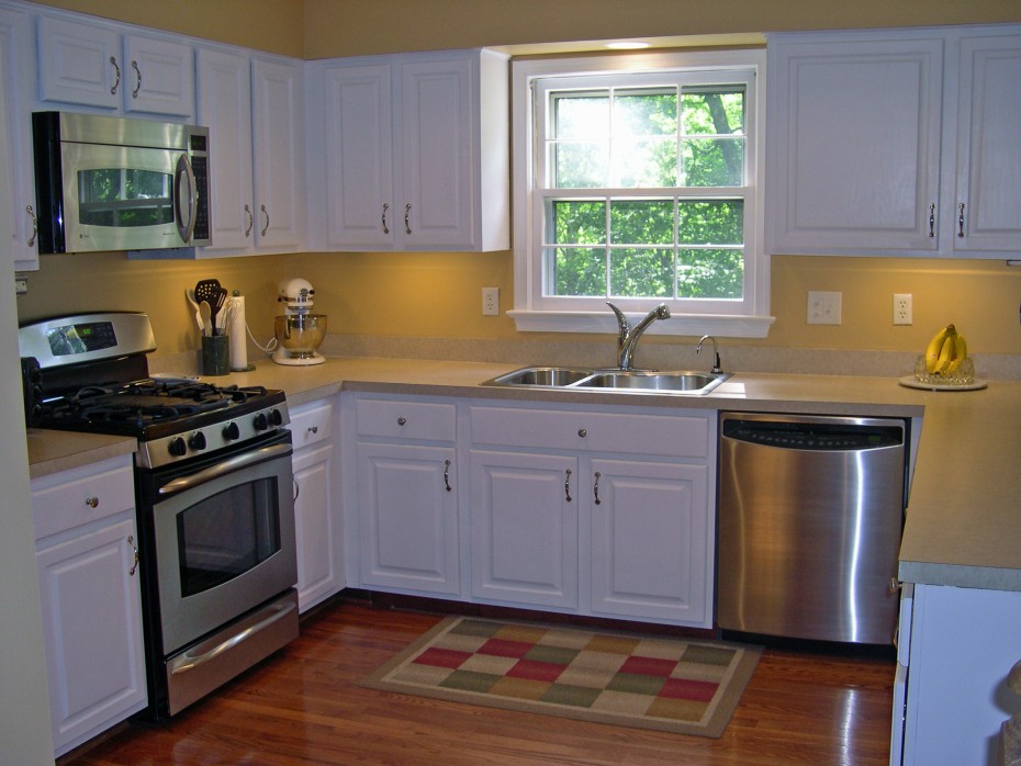 Charming Yellow Wall Painted Also White Wood Cabinet Set In Small Kitchen Plan Also Laminate Wood Floors Schemes Prodigious Small Kitchen In Efficient As Well As Creative Schemes Kitchen Designs