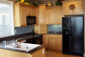 Decoration Thumbnail size Decoration Excellent Small Kitchens Styles Escorted By Pine Wooden Kitchen Cabinet As Well As Wooden Floors Also Microwave Shelves In Vintage Style Decors Prodigious Small Kitchen In Efficient Practical And Anti-Scratch Laminated Wood Floors