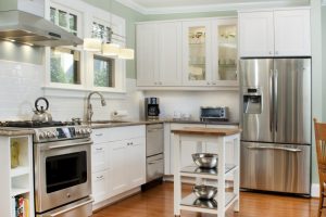 Decoration Thumbnail size Exquisite Chrome Triple Doors Refrigerators For Modern Small Kitchen Added White Cabinetry Set As Well As Small Island Cart On Wood Floors Views Prodigious Small Kitchen