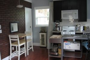 Kitchen Designs Thumbnail size Kitchen Charming Small Wooden Espresso Kitchen Cabinets Also 3 Pieces Dining Set Escorted By Brick Exposed Wall Panels Also Stainless Kitchen Island Cart On Wood Floors As Well As White Electric