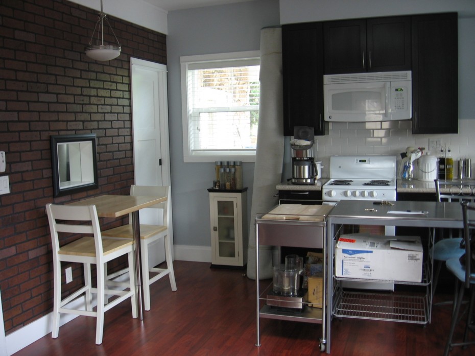 Kitchen Charming Small Wooden Espresso Kitchen Cabinets Also 3 Pieces Dining Set Escorted By Brick Exposed Wall Panels Also Stainless Kitchen Island Cart On Wood Floors As Well As White Electric Kitchen Designs