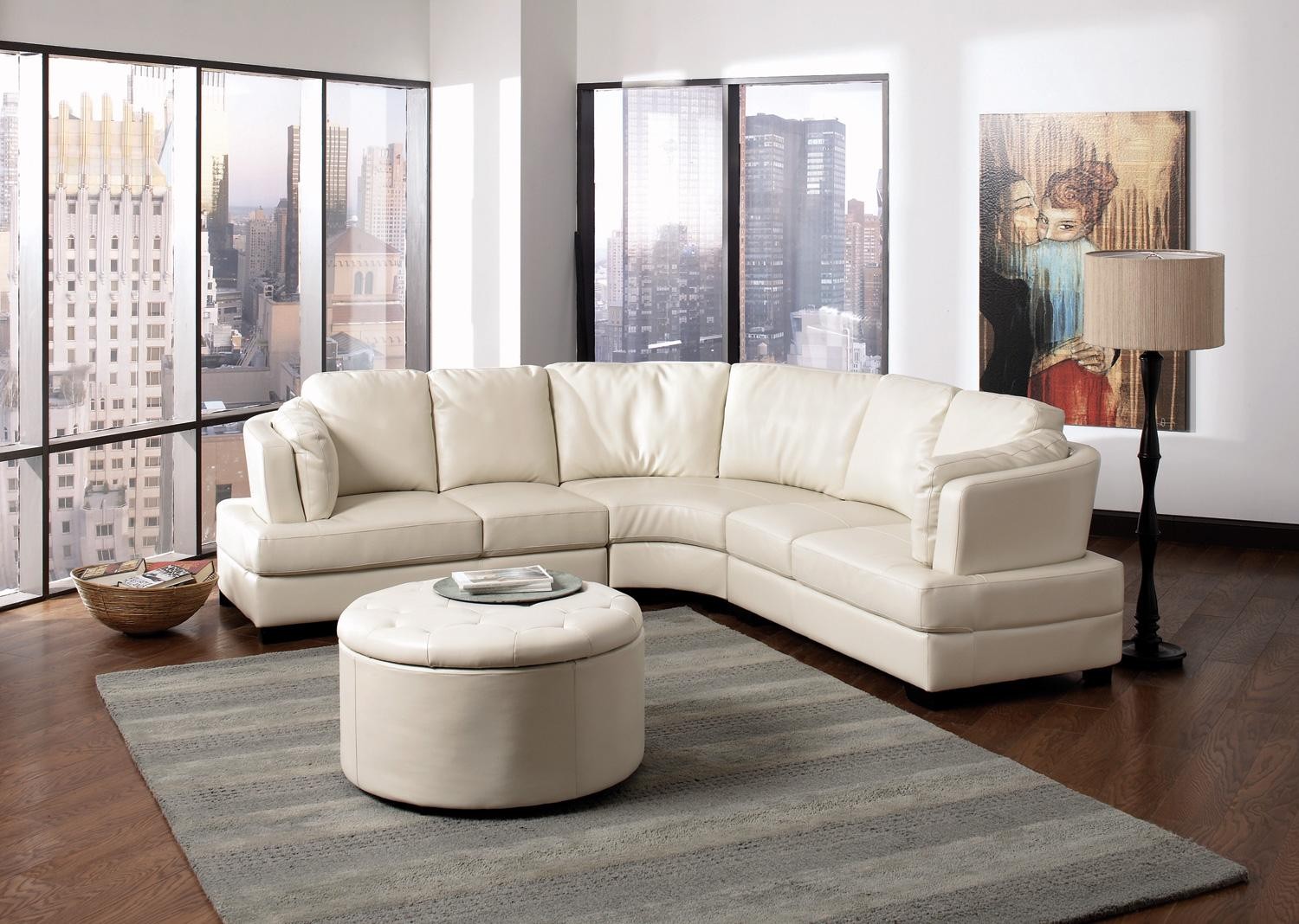 Simple Living Room Design With ELegance White Leather Sectional Sofa Furniture Set With Unique Table Wipes Simple Rug Laminated Wooden Floor Wall Paint Simple Lamp Wall And Large Window Furniture + Accessories
