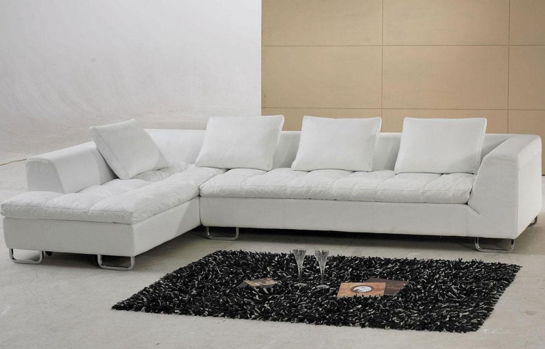 Furniture + Accessories White Leather Sectional Sofa Ideas With Black Fur Rug Magazines Glass White Pillow Modern Floor White And Brown Floor Ideas For Minimalist Small Home Interior Best Leather Sectional Sofa for Modern Home Furniture