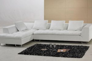 Furniture + Accessories White Leather Sectional Sofa Ideas With Black Fur Rug Magazines Glass White Pillow Modern Floor White And Brown Floor Ideas For Minimalist Small Home Interior Simple-Living-Room-Design-with-ELegance-White-Leather-Sectional-Sofa-Furniture-Set-with-Unique-Table-Wipes-Simple-Rug-Laminated-Wooden-Floor-Wall-Paint-Simple-Lamp-Wall-and-Large-Window