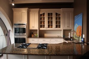 Ideas Application Of Recycled Glass On The Black Marble Kitchen Island Top Nice Wooden Wall Decoration Cheap But Beautiful Interior Made From Recycled Material Countertops Artistic-Sink-Wastafel-Made-From-Recycled-Glass-On-The-Beige-Marble-Top-Cool-Temperd-Glass-Wall-Countertop-Beautified-By-Small-Spotlighted-Wall-Lamps-Cheap-But-Interior