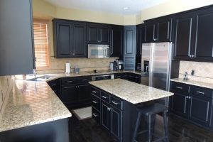 Kitchen Designs Thumbnail size Awesome White Granite Countertop Escorted By Dark Wood Cabinets Base As Well As Single Armless Stools In Small Space Black Kitchen Decors Piquant Dark Wood Cabinets For Women Dream Kitchen