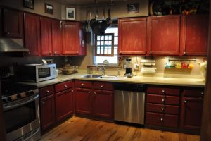 Kitchen Designs Thumbnail size Cool Rustic Dark Wood Cabinets For L Shaped Kitchen Cabinets On Wooden Flooring As Decorate Vintage Style Kitchen Schemes Piquant Dark Wood Cabinets For Women Dream Kitchen