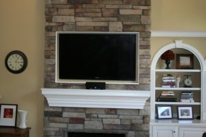 Kitchen Designs Thumbnail size Corner Stone Fireplace Escorted By River Rock Walling Cool Gypsum Wall Tv Shelves In White Colour Intimating Woden Cabinet Escorted By Book Shleves Corner Stone Fireplace For Beautiful Livingroom