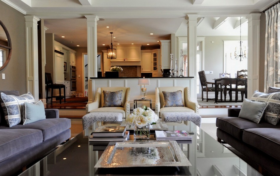 Luxurious Living Room Escorted By Dark Grey Upholstered Sofa Also Brown Painted Wall Escorted By Wall Mirror Also Wide Table Escorted By Black Glass Worktop Also Glass Flower Vase Fabulous Home Ideas