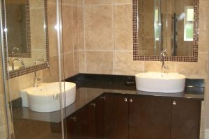 Bathroom Designs Thumbnail size Bathroom Designs Minimalist Schemes Plan Using Rectangular Mirrors Ceiling Fittings Also Escorted By Oval White Sinks Silver Widespread Faucets Brown Wooden Cabinets Black Granite Countertops The Design Of Small Toilets For Small Bathrooms