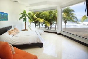 Bedroom Designs Thumbnail size Amazing Modern Bedroom Design Ideas With Beautiful Beach Landscapes White Bed White Comfy Sofa Orange Sofa White Wall White Ceramic Flooring Bay Window