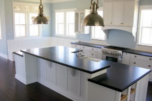 Ideas Thumbnail size Clean White Kitchen Island Design With Black Countertop Laminate Flooring White Cabinet White Window For White Kitchen Design Ideas With Wooden Flooring Design Ideas