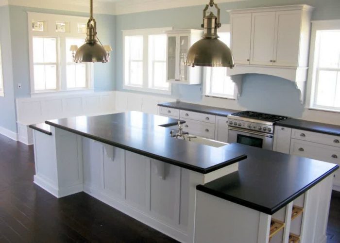 Ideas Clean White Kitchen Island Design With Black Countertop Laminate Flooring White Cabinet White Window For White Kitchen Design Ideas With Wooden Flooring Design Ideas Hardwood Laminate Flooring Cost For Some Types Of Wood