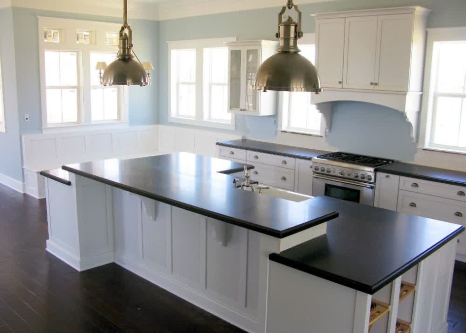 Clean White Kitchen Island Design With Black Countertop Laminate Flooring White Cabinet White Window For White Kitchen Design Ideas With Wooden Flooring Design Ideas Ideas