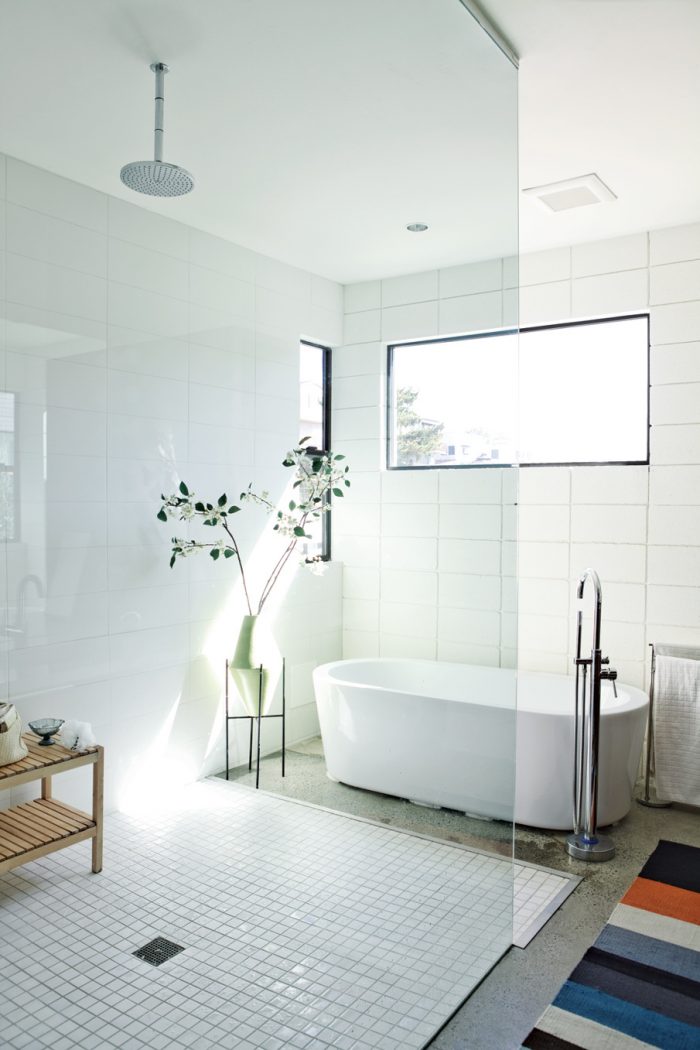 Bathroom Designs Comely Image Of White Dwell Magazine Bathroom Decoration Using Mount Ceiling Round Shower Head Including Oval White Ceramic Freestas Well Asing Bathtub As Well As White Mosaic Tile Bathroom Flooring Breath Cozy Minimalist Bathroom Designs