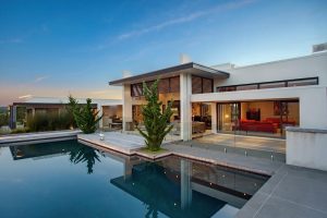 Interior Design Thumbnail size Contemporary Architecture With Swimming Pool In Front Of Modern Home Design Red Comfy Sofa Large Sliding Glass Door Yellow Lighting Wood Floor White Wall Modern Architecture Ideas