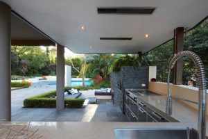 Kitchen Designs Thumbnail size Gorgeous Outdoor Kitchen Spaces Escorted By L Shaped Kitchen Cabinet Over The Stainless Steel As Well As Nice Faucet Also Grey Bick Wall Decoration Outdoor Kitchen Counter Tops Appliances