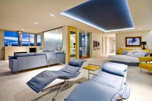 Ideas Thumbnail size Interior Home Design Ideas Cream Comfy Sofa Glass Wall Cream Wall Cream Flooring Blue Lounge Chair Blue Cozy Sleeping Chairs Small Yellow Coffe Table Black Table Ideas