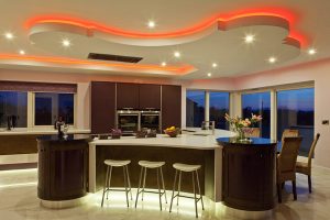 Kitchen Designs Thumbnail size Kitchen Countertop White Wall Glass Window Rattan Chair Bar Stool Glass Of Wine Purple Teapots Stainless Faucet Oven Cool Wall Brown Kitchen Island Brown Kitchen Cabinet Ceramic Floor Orange Lamp