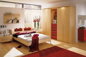 Interior Design Thumbnail size Modern Bedroom Design Ideas Red Carpet Flooring Wooden Flooring White Wall Red Pillow Large Wardrobes Fresh Cut Flower Bookshelves Chest Of Drawer Mirror Glass Window Cozy Bed Interior Bedroom Ideas