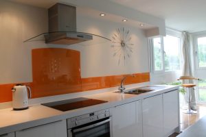 Kitchen Designs Thumbnail size Orange Splashback White Wall Glass Window White Curtain Stainlees Faucet Washing Stand White Kitchen Island Bar Stool Oven Laminate Flooring White Thermos Small Lamp Design