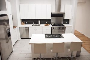 Kitchen Designs Thumbnail size Minimalist Kitchen Design Ideas With White Kitchen Units Design And Stainless Range Hood Also White Kitchen Island Design With Stove And Seating And Grey Ceramic Tile Floor Design