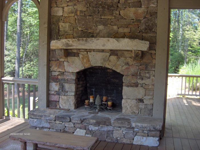 Living Room Designs Rustic Stone Fire Place Styles Scheme For Outdoor Lounge Spaces Escorted By Natural Shelf Also Antique Candle Holders Also Wooden Table Escorted By Simple Railings Of Stone Fireplaces Stone Fireplaces For Modern And Minimalist Houses